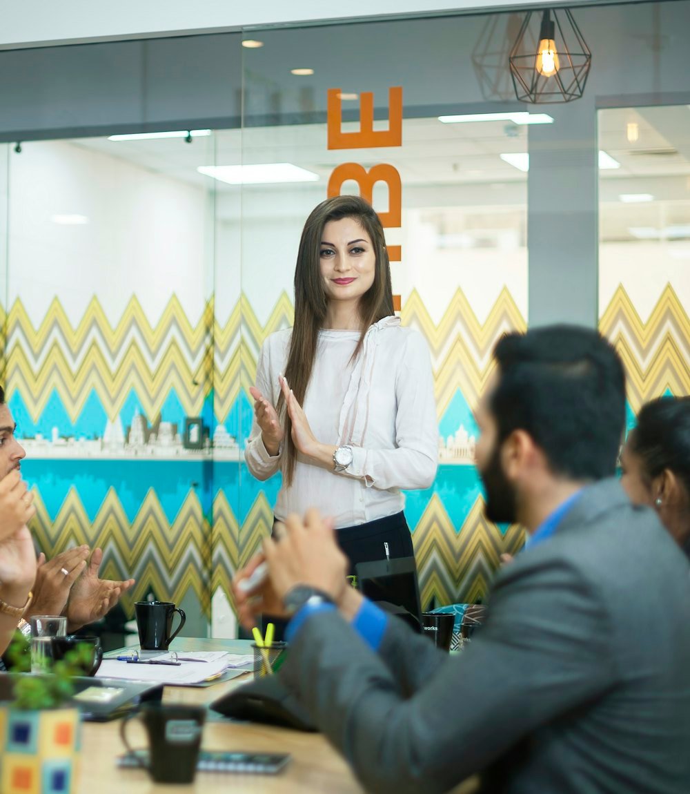 Business team discussing plans around a meeting table