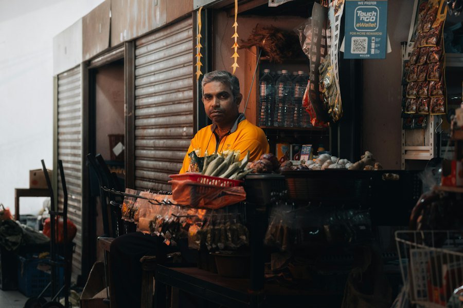 Shop owner standing at the front of his store